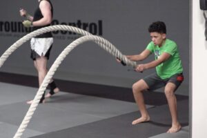 Child working out with ropes during conditioning