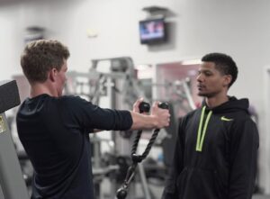 Personal trainer working with a client
