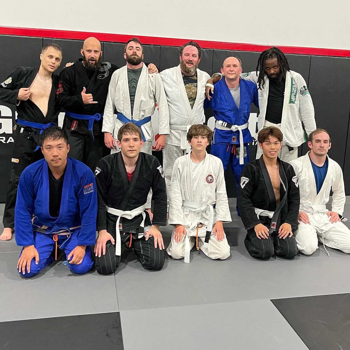 Students practicing martial arts techniques during a fitness class.