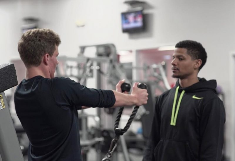 Personal trainer working with a client